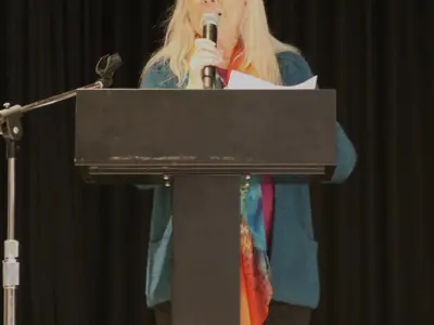 Colleen Purdon speaking at a podium