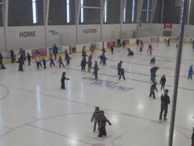People skating on ice at the Rec Centre arena