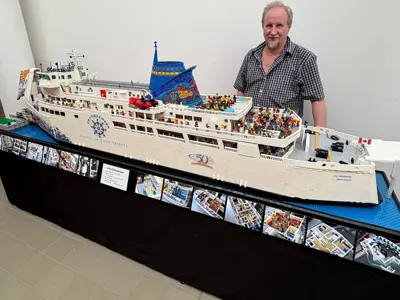 Picture of Ken Reid and his LEGO Chi-Cheemaun replica he created and built