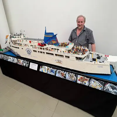 Picture of Ken Reid and his LEGO Chi-Cheemaun replica he created and built