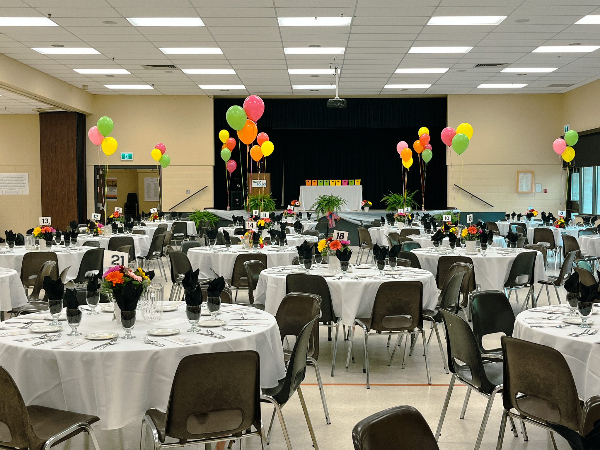 image of Banquet room set with tables chairs and balloons