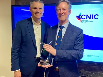 Mayor Boddy accepting CNIC award beside James Scongack