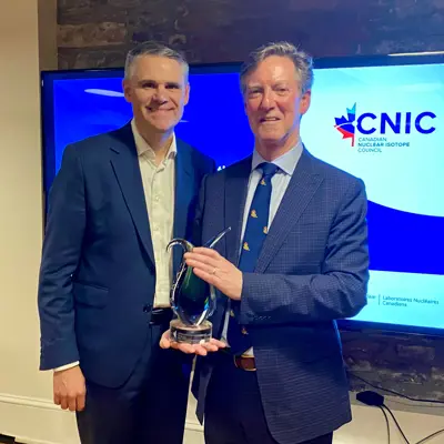 Mayor Boddy accepting CNIC award beside James Scongack