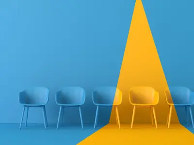 Blue and yellow chairs in front of wall