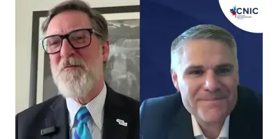 A screenshot of two men in blue suits, Mayor Ian Boddy and Bruce Power COO James Scongack, speaking to each other in a video podcast.