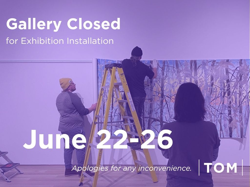 Three people install artwork in a gallery space during exhibition setup. One person stands on a ladder adjusting a large multi-panel painting while two others assist nearby. Overlaid text reads: “Gallery Closed for Exhibition Installation, June 22–26. Apologies for any inconvenience.”
