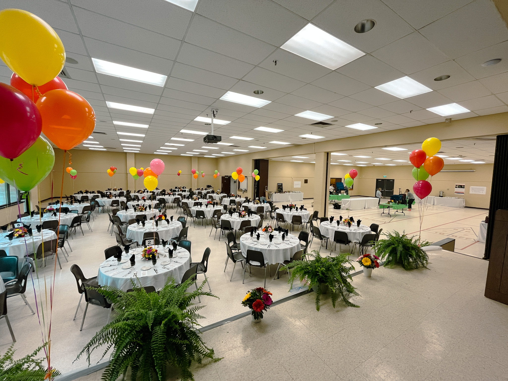 image of Banquet room set with tables chairs and balloons