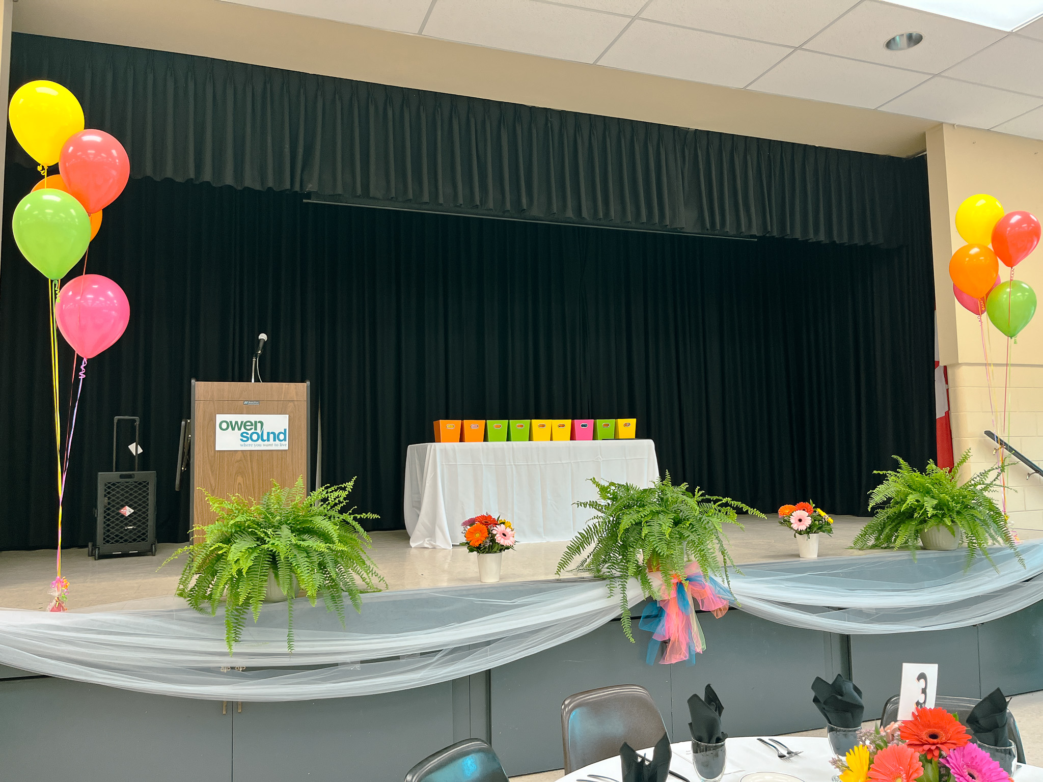 image of Banquet room set with tables chairs and balloons