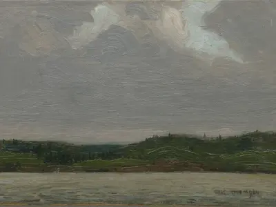 A small oil sketch depicting a calm lake in the foreground and a low, tree-covered shoreline stretching across the horizon. Heavy grey clouds fill most of the sky, painted with sweeping brushstrokes that emphasize texture and movement. The subdued palette conveys an overcast, atmospheric day in the Canadian wilderness.